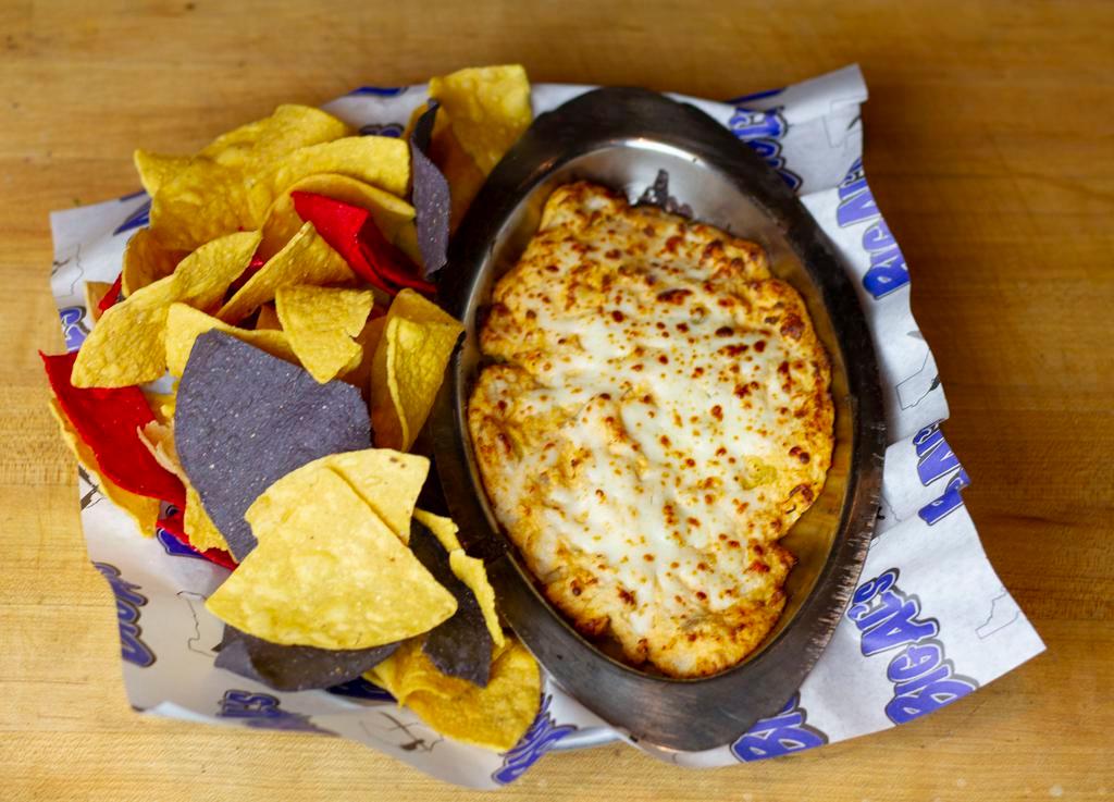 Buffalo Chicken Dip · Cheese sauce loaded with chicken, green chilis, and Frank’s red hot. Warm tortilla chips on the side.