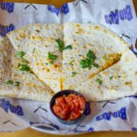 Quesadilla · House shredded chicken tinga with cheddar and mozzarella cheeses.