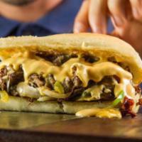 Philly Cheesesteak Sandwich · Culinary inspired prime sirloin, mozzarella cheese, beer cheese fondue, sauteed green pepper...