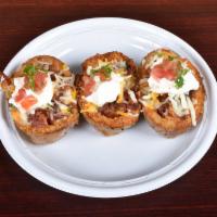 Loaded Potato Skins · Applewood smoked bacon, Monterey Jack cheese and sour cream.