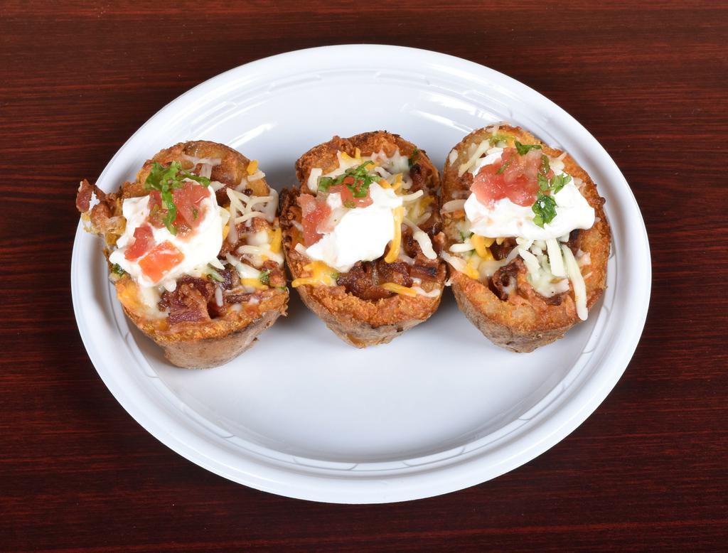 Loaded Potato Skins · Applewood smoked bacon, Monterey Jack cheese and sour cream.