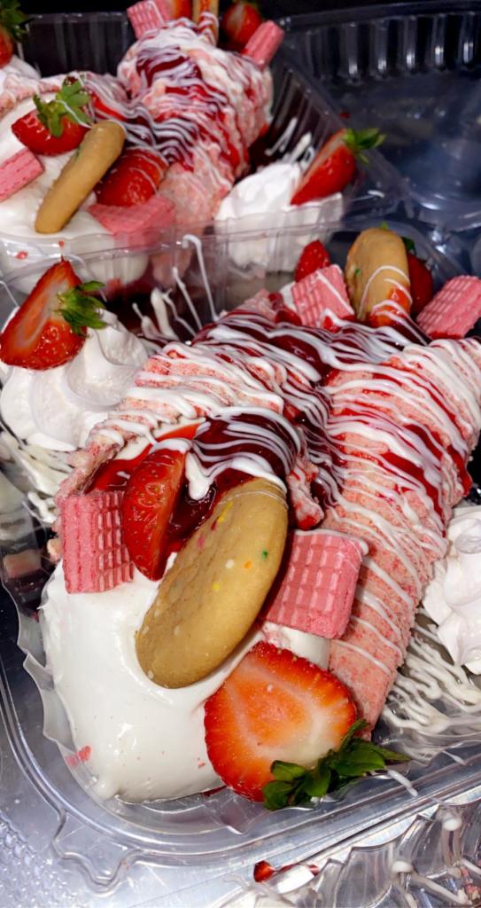 Cheesecake Cones · Strawberry shortcake cheesecake pan topped with delicious fresh slice strawberries.