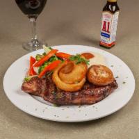 New York Shell Steak · Broiled or blackened and topped with mushrooms and onion rings.