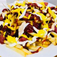 Salchipapas · French fries with beef hotdog topped with mustard, ketchup and mayo.8