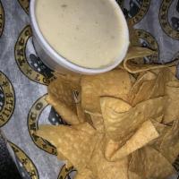Cheese dip and chips  · Creamy dip made from melted cheese. 