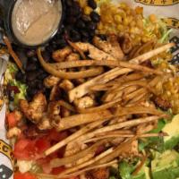 Mexican Cesar Salad · Romaine lettuce, grilled chicken, roasted corn, black or pinto beans, avocado, tomato,tortil...