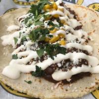 3. Taco de Mole · Chicken in mole sauce, roasted corn, queso Cotija, crema Mexicana and cilantro.