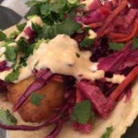 11. Cod Taco · Fried cod, chipotle aioli, red cabbage and cilantro.
