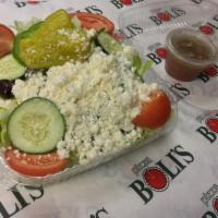 Greek Salad · Mixed lettuce, green pepper, tomato wedges, red onion, cucumbers, Kalamata olives, banana pe...