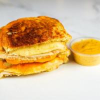 Roasted Turkey & Three Cheese Melt · Roasted turkey breast, Cheddar, Swiss, and Parmesan cheese melted between buttery, toasted s...