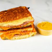 Smoked Ham & Three Cheese Melt · Smoked ham, Cheddar, Swiss, and Parmesan cheese melted between buttery, toasted sourdough br...