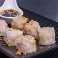 Shumai · 6 pieces. Steamed or fried floured and filled with shrimp, served with tangy roasted garlic ...