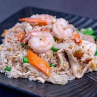  House Fried Rice · House fried rice with chicken, shrimp, egg, onions, snow peas, green peas and carrots.