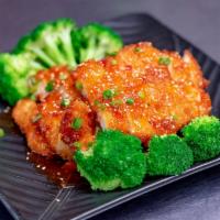 Orange Chicken · Crispy chicken with broccoli, peppers, carrot, string beans, baby corns, sweet chili sauce a...