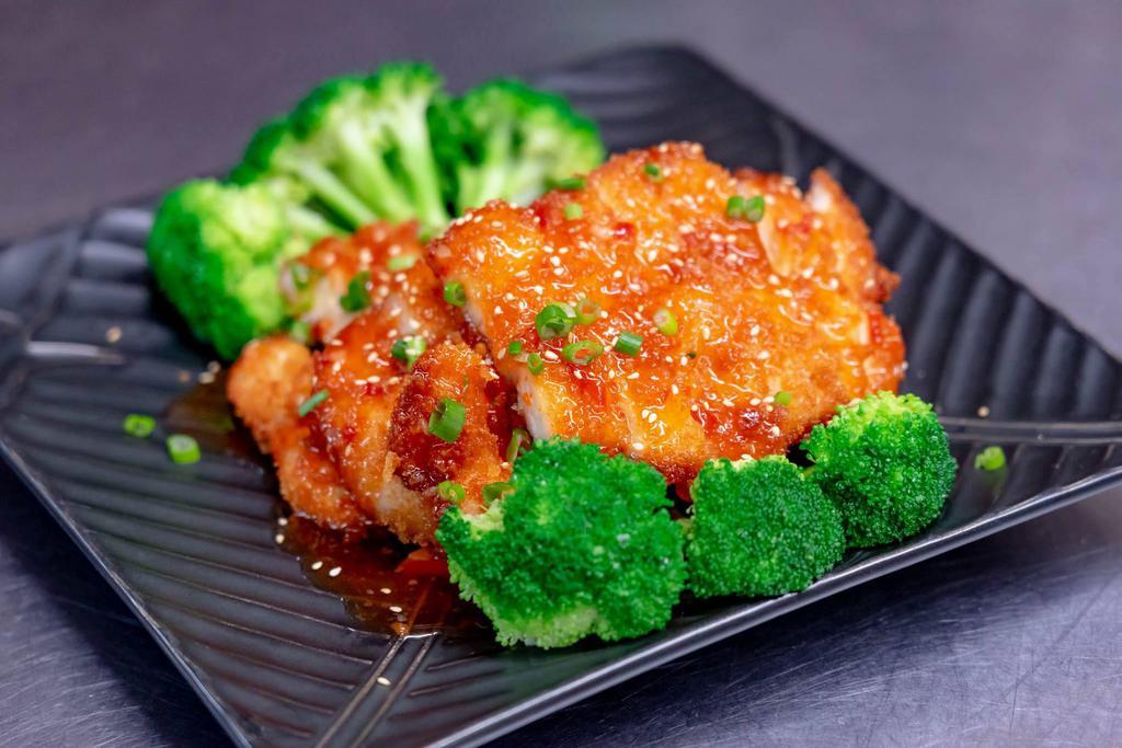Orange Chicken · Crispy chicken with broccoli, peppers, carrot, string beans, baby corns, sweet chili sauce and sprinkle with sesame and scallions.