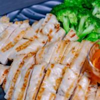 Thai Grilled Chicken · Marinated grilled chicken with steamed broccoli and carrots served with sweet sour sauce.