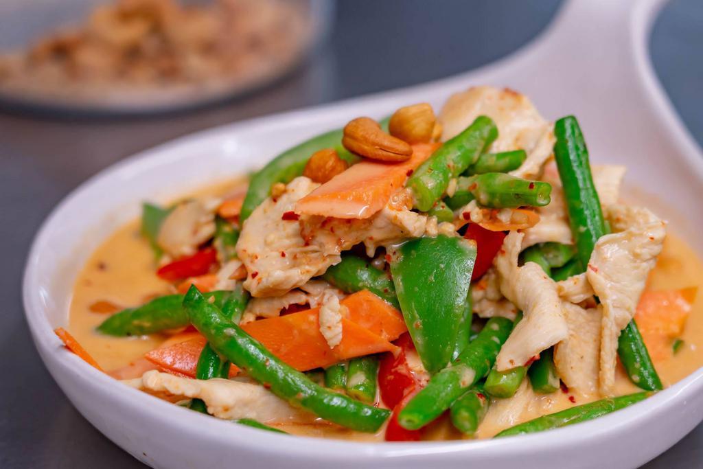 Bangkok String Bean  · Chicken sautéed with string beans, snow peas, peppers, carrots, ground peanut and cashew nuts in mild curry sauce..