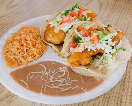 Fish Taco Plate · Two fish tacos served with rice and beans.