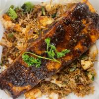 Grilled Salmon · Grilled  salmon serve with jollof rice.