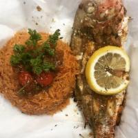Red Snapper · Red snapper fried marinated in our smoke city seasoning sauce.