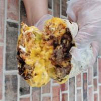Burrito Fries · Grilled Steak Burrito Stuffed with French Fries, Nacho Cheese, Guacamole, and Sour Cream