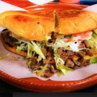 Torta de Carne Asada · Torta with Grilled Steak, Lettuce, Tomato, Cheese, Avocado, Jalapeno, and Mayonnaise