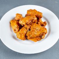 Wings · 10 lightly breaded and fried chicken wings tossed in your choice of sauce served with bleu c...