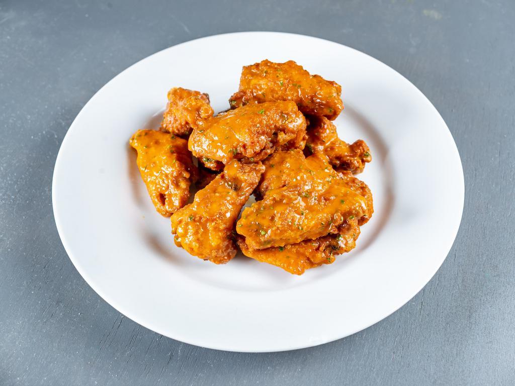 Wings · 10 lightly breaded and fried chicken wings tossed in your choice of sauce served with bleu cheese or ranch.



