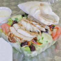 Grilled Chicken Salad · Our signature salad! Chicken marinated in olive oil and select herbs and spices, grilled to ...