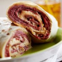 Reuben Wrap · Grilled pastrami, Swiss cheese, coleslaw and Russian dressing.