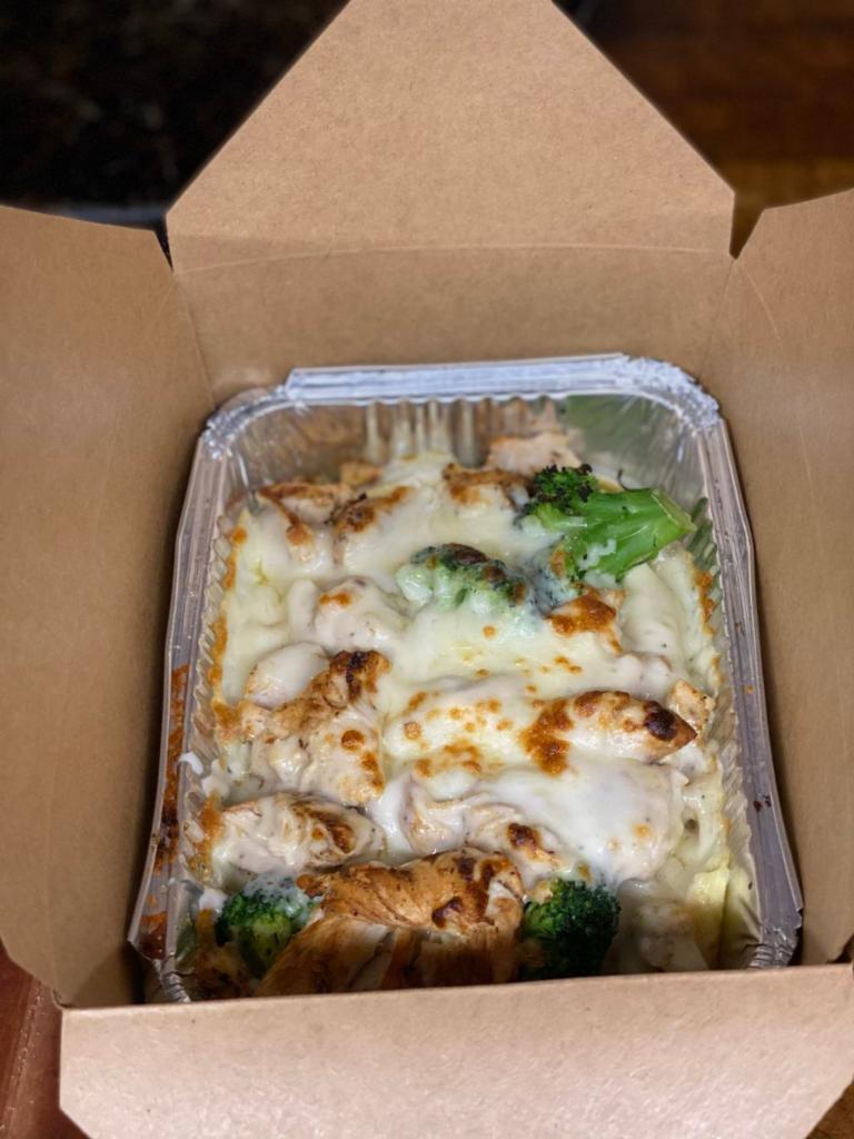 Chicken Broccoli Alfredo Pasta · Grilled marinated chicken, fresh broccoli and homemade Alfredo sauce served on a bed of ziti.