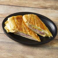 Sandwich de Jamon, Queso and Huevos · Ham, cheese and fried eggs sandwich.
