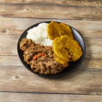 Ropa Vieja · Shredded beef in tomato creole sauce.