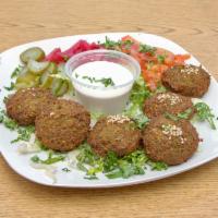 Falafel  · Fava beans and chickpeas with seasoning & cooked in vegetable oil. (6 pcs)