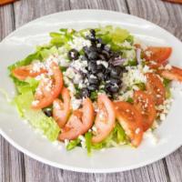 Green Salad · Romaine lettuce, fresh tomato, green pepper, black olives, red onions and mozzarella cheese.