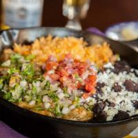 Chile Verde Entrada · Slow-cooked tender pork in a poblano pepper and tomatillo sauce. Topped with diced red onion...