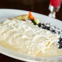 Queen Enchiladas · A rich blend of Oaxaca, cotija and goat cheese mixed with sauteed spinach, shallots and garl...