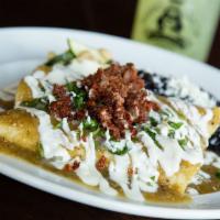 Suizas Enchiladas · Tender pulled chicken and creamy Oaxaca cheese. 
Topped with our homemade tomatillo sauce, ...