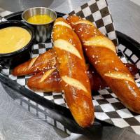 Pretzel Sticks · Lightly salted soft pretzels, served warm alongside our homemade pretzel cheese and carameli...