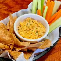 JoJo's Buffalo Chicken Dip · Warm, creamy dip with chicken breast and a kick of buffalo sauce. Served with chips and vegg...