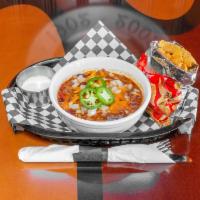 Loaded Chili · Topped with cheddar cheese, onion, and fresh jalapeno. Served with sour cream and Frito's ch...