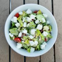 The Greek · Rich feta, tomato, cucumber, roasted red pepper, olives, red onion, herb vinaigrette.