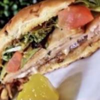 The Big Milly  · Hot served sandwich on an onion bun with cajun turkey, honey roasted turkey, smoked ham, roa...
