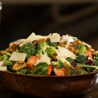 Garden Salad · Fresh baby greens, shaved carrot and radish, Roma tomato, broccoli, aged white cheddar, cand...