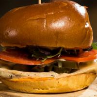 Spicy Chicken Sandwich · Marinated chicken breast, grilled Serrano peppers, white cheddar cheese, chipotle aioli, fre...