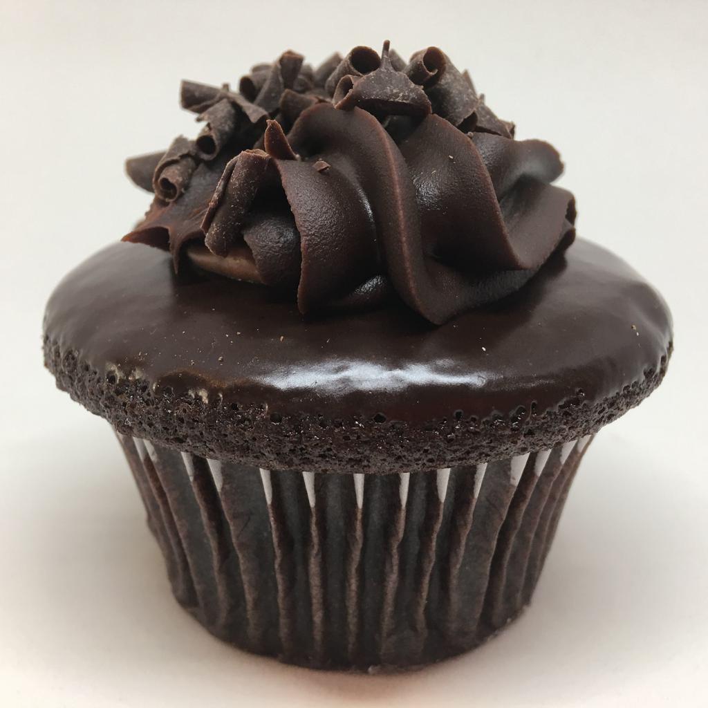 Chocolate Mousse · Chocolate cake filled with chocolate mousse, topped with chocolate ganache and chocolate curls