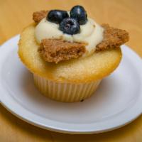 Blueberry Cheesecake Cupcake · Vanilla blueberry cake topped with cream cheese pastry cream mix, homemade graham cracker, a...