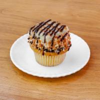 Samoa · Vanilla cake with a caramel filling, topped with buttercream, a chocolate and caramel drizzl...