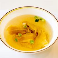 S4. Wonton Soup · Seasend broth with filled wonton dumplings.
