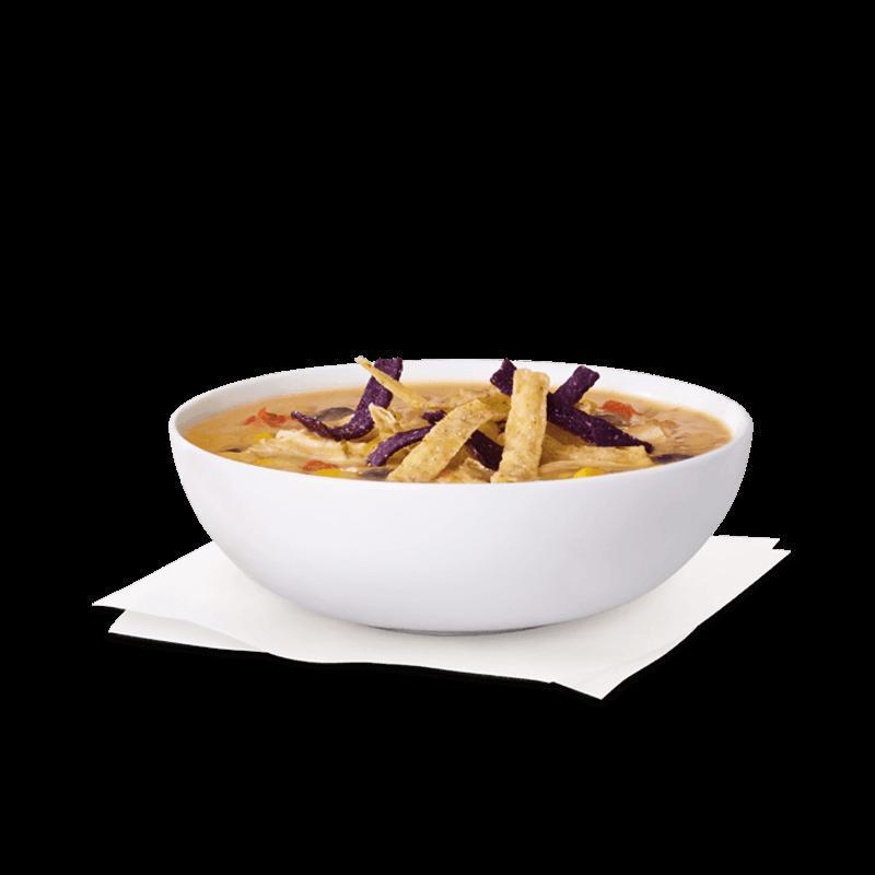 Chicken Tortilla Soup · Shredded chicken breast with navy and black beans in a white creamy soup base with a perfect blend of vegetables and spicy heat. Topped off with seasoned corn tortilla strips. Seasonal item only.